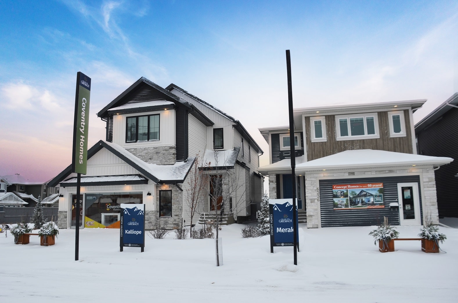 Two attached garage show homes on a snowy, winter day. Signage indicates Coventry Homes’ Kalliope model and Concept Homes’ Meraki model.