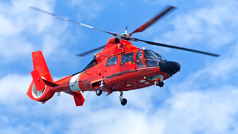 A red medical helicopter in the sky.

A red medical helicopter in the sky.

